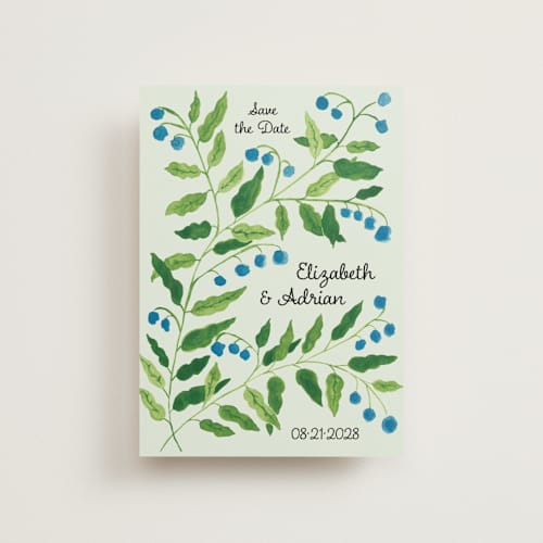This is a mint save the date postcards with standard by Studio Suku called lily of the valley printing on signature in postcard