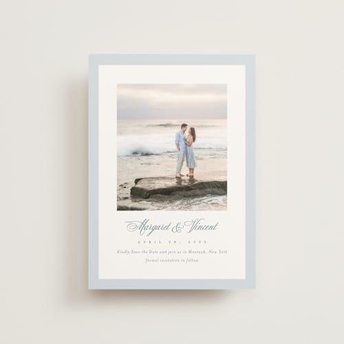 This is a dusty blue save the date postcards with standard by Jennifer Postorino called coastal charm printing on signature in postcard