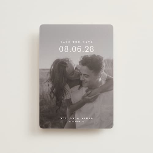 This is a moonstone petite save the dates with standard by Lucrecia Caporale called classic big date printing on recycled smooth signature in petite