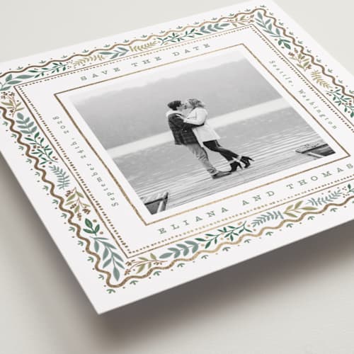 This is a snow foil stamped save the date cards with foil pressed by Alethea and Ruth called square leafy border printing on recycled smooth signature in square