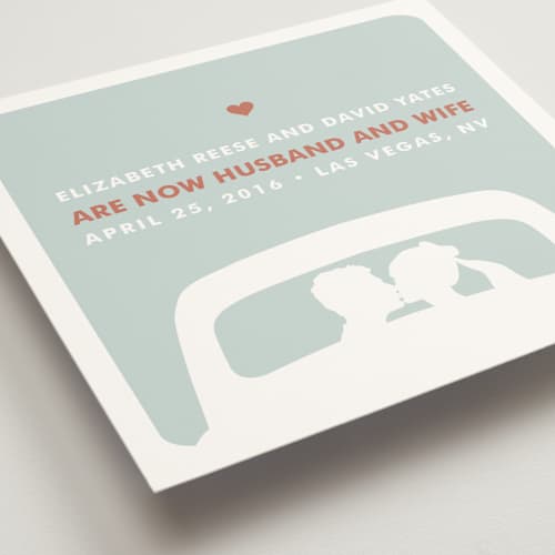 This is a light teal wedding announcements with standard by Three Kisses Studio called just married printing on signature in standard