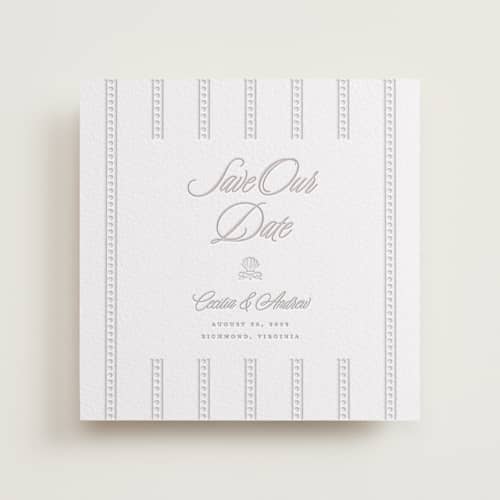 This is a dove grey save the date with letterpress by Vera Lim called shell border printing on white cotton in standard
