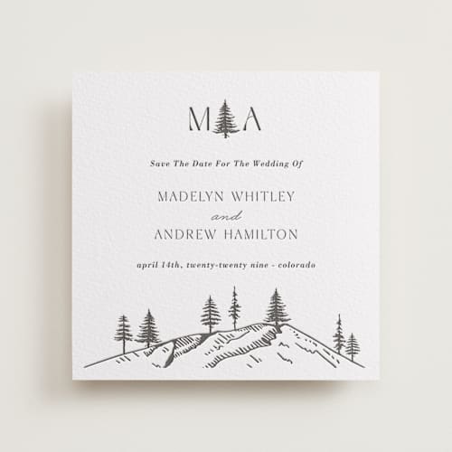 This is a soft black save the date with letterpress by Winston Latchman called mountain pines printing on white cotton in standard
