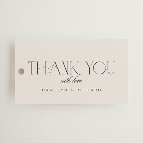 This is a tan wedding favor tags with standard by chocomocacino called nocturne printing on signature in tag