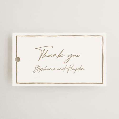 This is a champagne wedding favor tags with standard by Cass Loh called gilded frame printing on signature in tag