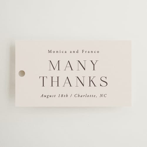 This is a cream wedding favor tags with standard by Hooray Creative called and centered printing on signature in tag