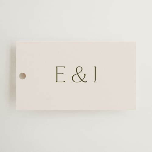 This is a almond wedding favor tags with standard by Olivia Kanaley Inman called blockprint printing on signature in tag