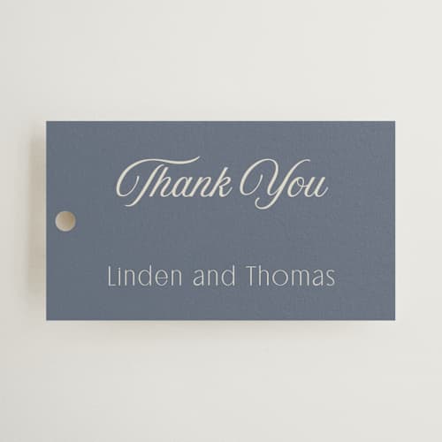 This is a french blue wedding favor tags with standard by Nicoletta Savod called ritzy printing on signature in tag