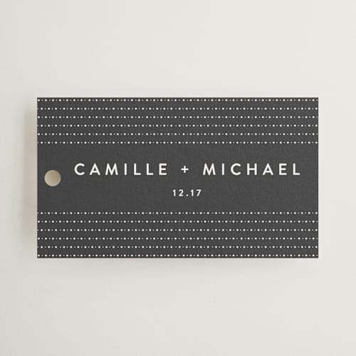 This is a soft black wedding favor tags with standard by Camille Robinson called modern glam printing on signature in tag