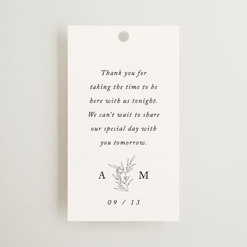 This is a pearl wedding favor tags with standard by Jennifer Postorino called initial printing on signature in tag