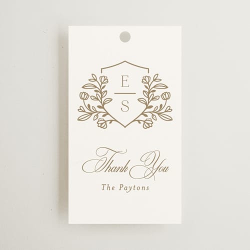 This is a ivory wedding favor tags with standard by Mansi Verma called gold crest printing on signature in tag
