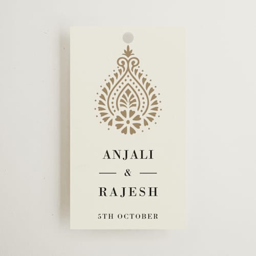 This is a champagne wedding favor tags with standard by Oma N. Ramkhelawan called henna stamp printing on signature in tag