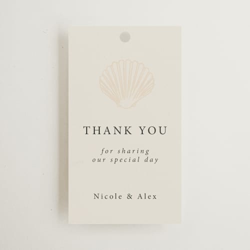 This is a sand wedding favor tags with standard by Hannah Bowman called simple seashell printing on signature in tag