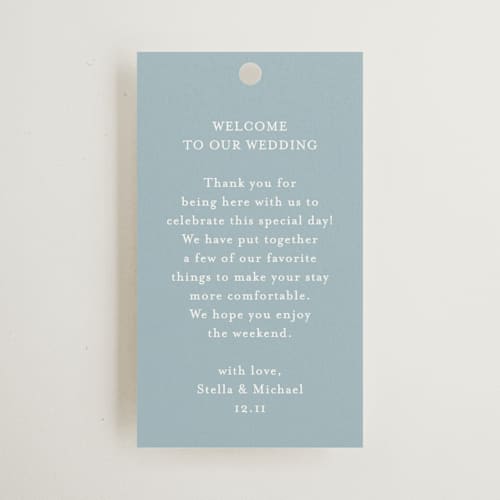 This is a powder blue wedding favor tags with standard by Jennifer Postorino called polished printing on signature in tag