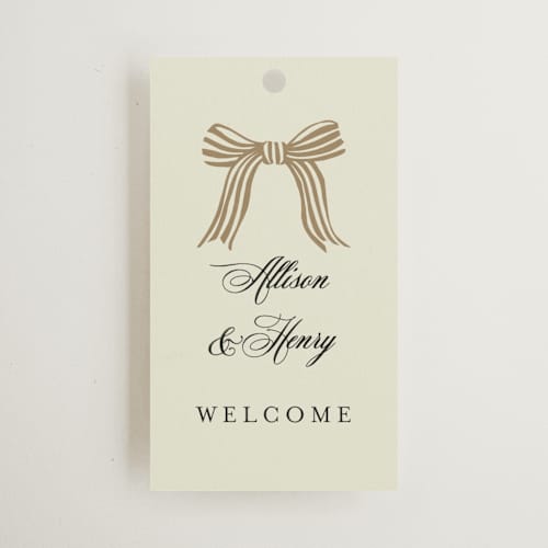 This is a champagne wedding favor tags with standard by Chris Griffith called all tied up printing on signature in tag