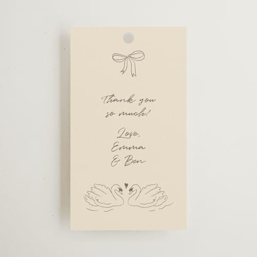 This is a buttercream wedding favor tags with standard by Helena Vitto called the swan printing on signature in tag