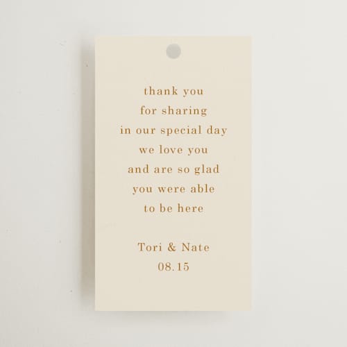 This is a cream wedding favor tags with standard by Baumbirdy called floral type arch printing on signature in tag