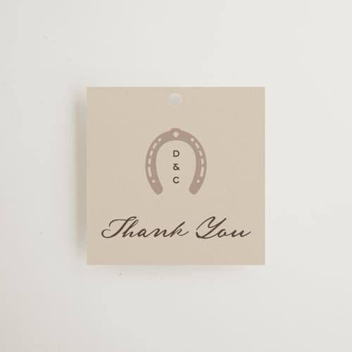 This is a leather wedding favor tags with standard by Jenna Holcomb called mountain ranch toile printing on signature in tag