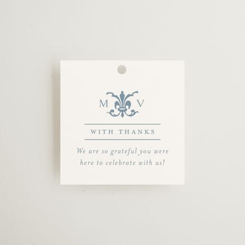 This is a dusty blue wedding favor tags with standard by Jennifer Postorino called coastal charm printing on signature in tag