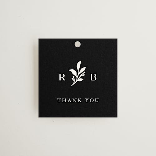 This is a black dahlia wedding favor tags with standard by Olivia Raufman called petite sprig printing on signature in tag