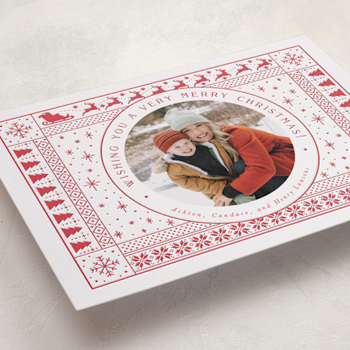 This is a poinsettia letterpress holiday cards with letterpress by Stephanie Hawkes called santa's sleigh printing on bright white letterpress paper in standard