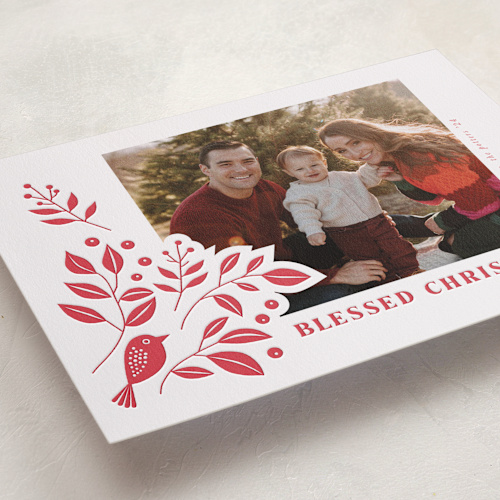 This is a poinsettia letterpress holiday cards with letterpress by Tatjana Koraksic called bird and foliage printing on bright white letterpress paper in standard