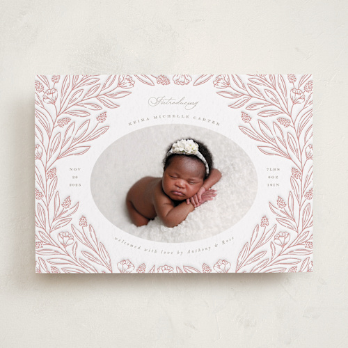This is a peach letterpress birth announcements with letterpress by Brandy Folse called floral border printing on bright white letterpress paper in standard