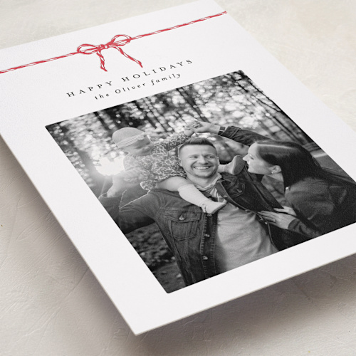 This is a peppermint letterpress holiday cards with letterpress by AK Graphics called with a bow printing on bright white letterpress paper in standard
