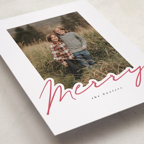 This is a snow letterpress holiday cards with letterpress by Angela Garrick called merry in red printing on bright white letterpress paper in standard