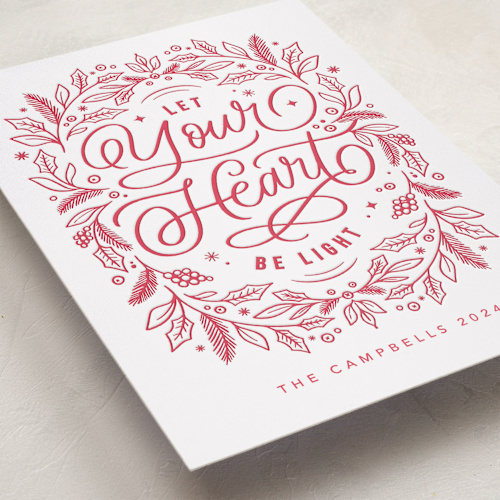 This is a poinsettia letterpress holiday cards with letterpress by Kristen Smith called let your heart be light printing on bright white letterpress paper in standard