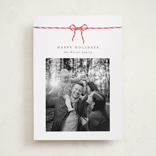 This is a peppermint letterpress holiday cards with letterpress by AK Graphics called with a bow printing on bright white letterpress paper in standard
