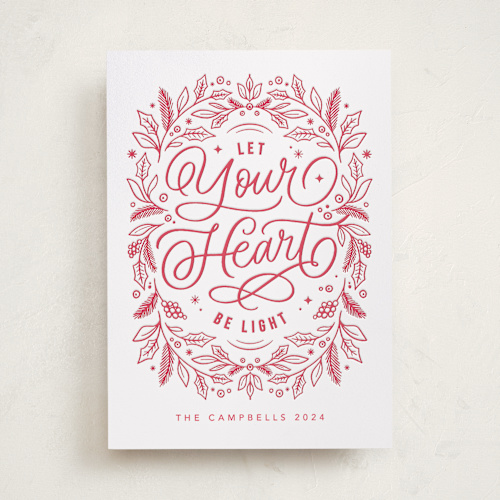 This is a poinsettia letterpress holiday cards with letterpress by Kristen Smith called let your heart be light printing on bright white letterpress paper in standard