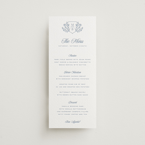 This is a provincial blue menu cards with letterpress by Hooray Creative called blue crest printing on somerset500 in 4x9