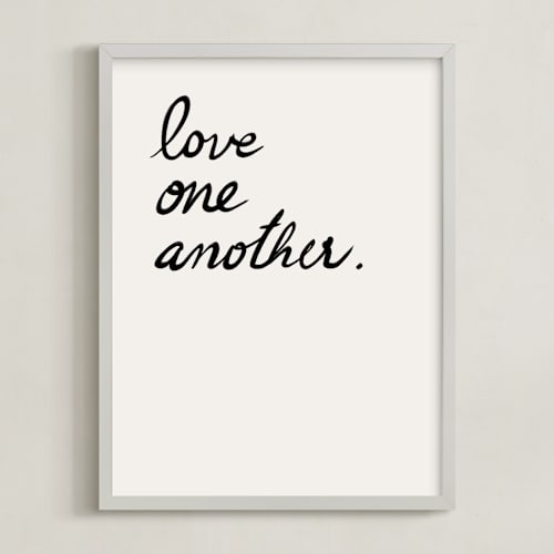 This is a white art by Maja Cunningham called love one, love all