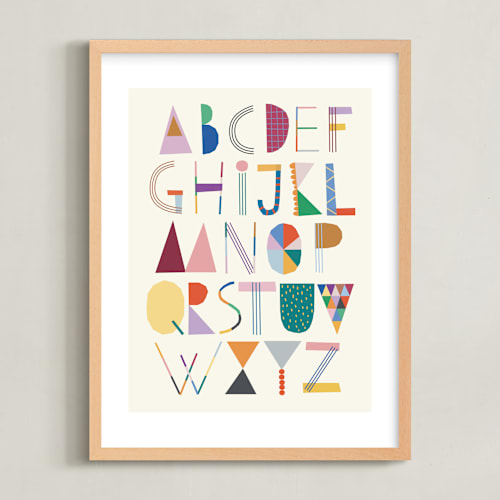 This is a rainbow kids wall art by lulu and isabelle called the most colorful alphabet