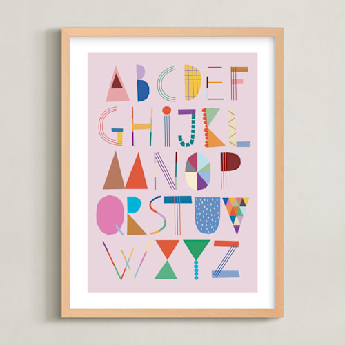 This is a cotton candy kids wall art by lulu and isabelle called the most colorful alphabet