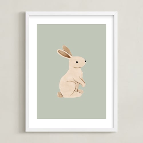 This is a green kids wall art by Vivian Yiwing called baby rabbit