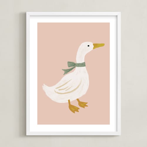 This is a blush nursery wall art by Cass Loh called duck with ribbon