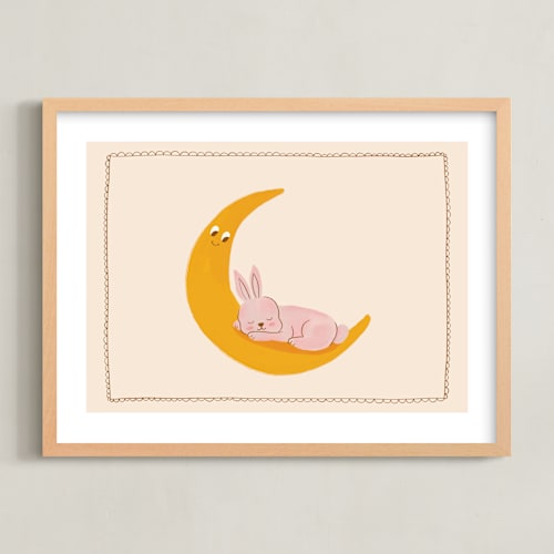 This is a beige nursery wall art with standard by Kartika Paramita called sleeping bunny