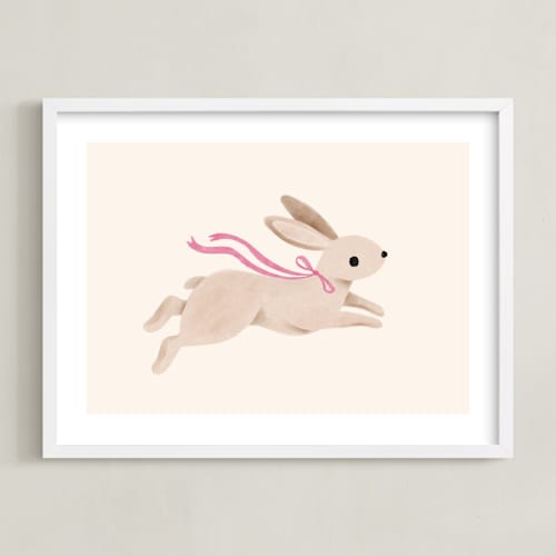 This is a pink nursery wall art by Vivian Yiwing called rabbit with bow