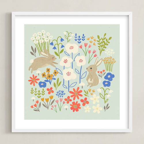 This is a seafoam blue kids wall art by Anne Lehman Stolpe called bunnies in the garden
