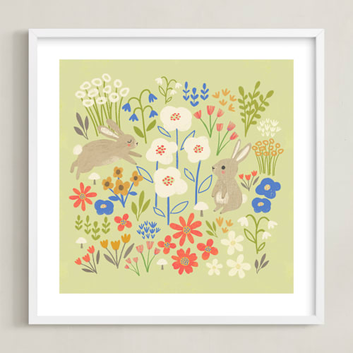 This is a light green kids wall art by Anne Lehman Stolpe called bunnies in the garden