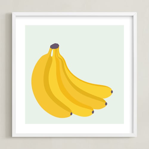 This is a soft blue kids wall art by Pippa Shaw called bunch of bananas