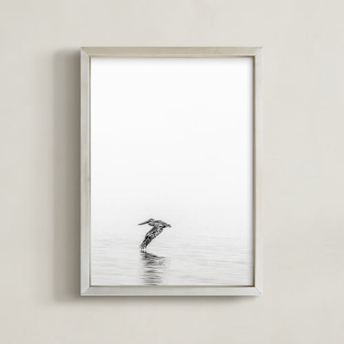 This is a medium grey art by Mary Ann Glynn-Tusa called pelican on lake