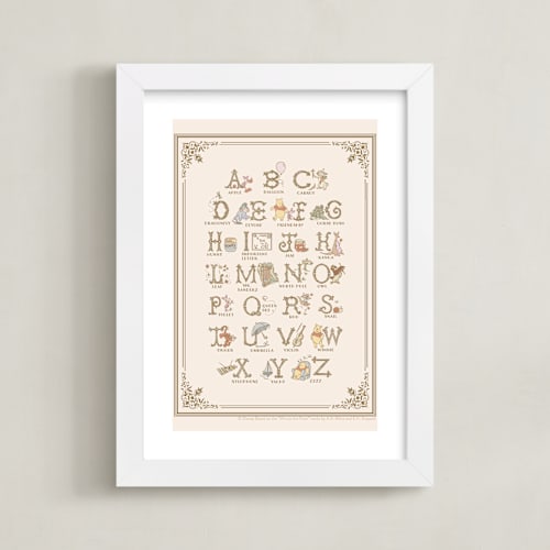 This is a beige disney art by Teju Reval called disney's pooh alphabet