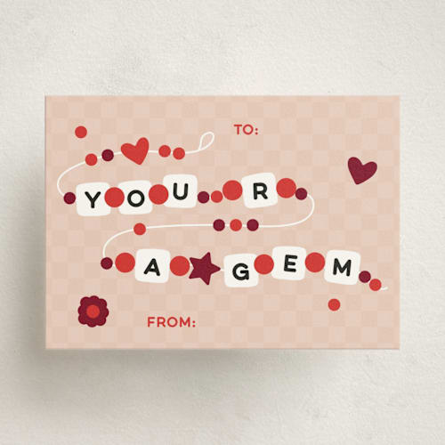 This is a peach kids valentines day cards with standard by Rachel Cassel called friendship bracelet printing on signature in standard