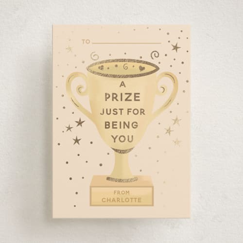 This is a peach kids valentines day cards with foil pressed by Jennifer Holbrook called a prize just for being you printing on signature in standard
