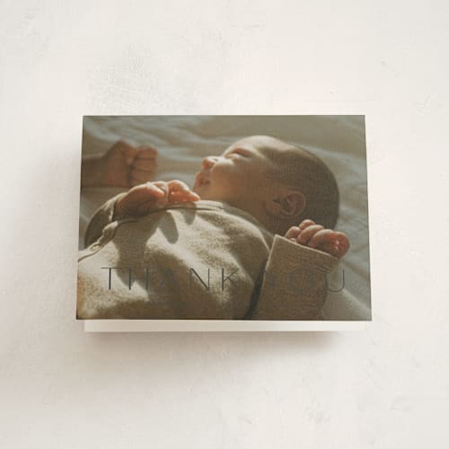 This is a dusk baby thank you cards with standard by Sara Hicks Malone called moondance printing on strathmore in standard