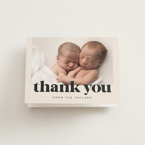 This is a ivory baby thank you cards with standard by Alethea and Ruth called ampersand duo printing on strathmore in standard