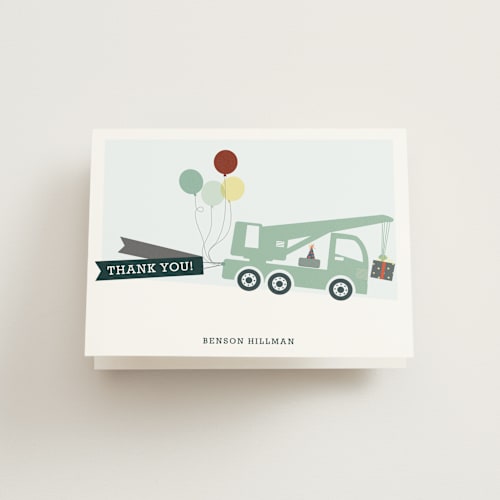 This is a grass kids thank you cards with standard by Rebecca Bowen called trucks on parade printing on strathmore in standard